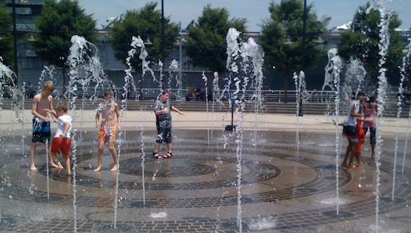 Kids playing in sprinkler in NYC